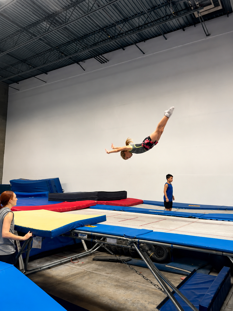 Kids jumping on trampolines with a coach at High Altitude Tumbling in Provo