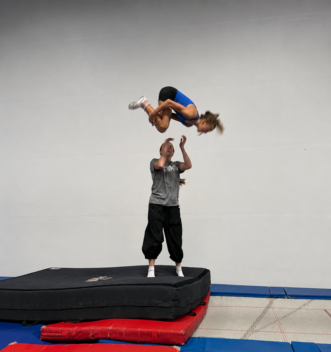 Kids jumping on trampolines with a coach at High Altitude Tumbling in Provo