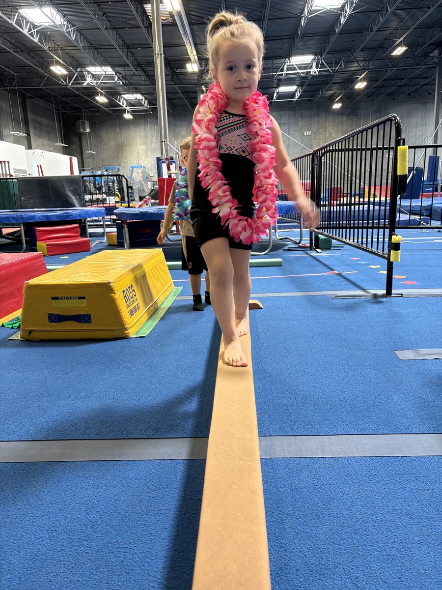 Gymnast training on the balance beam at High Altitude Tumbling in Provo